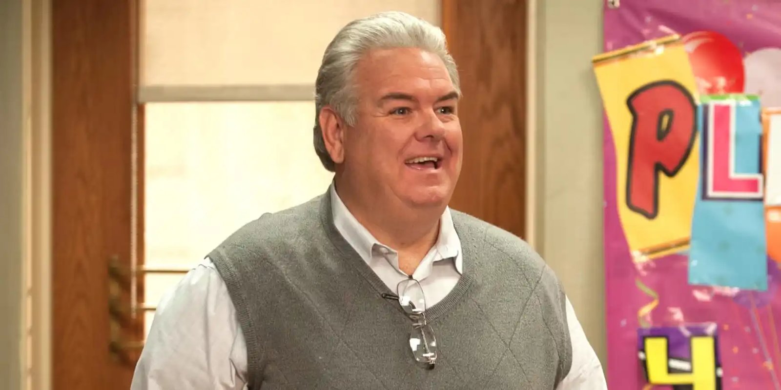 Jerry, played by Jim O'Heir, wearing a grey sweater vest and smiling on Parks & Recreation